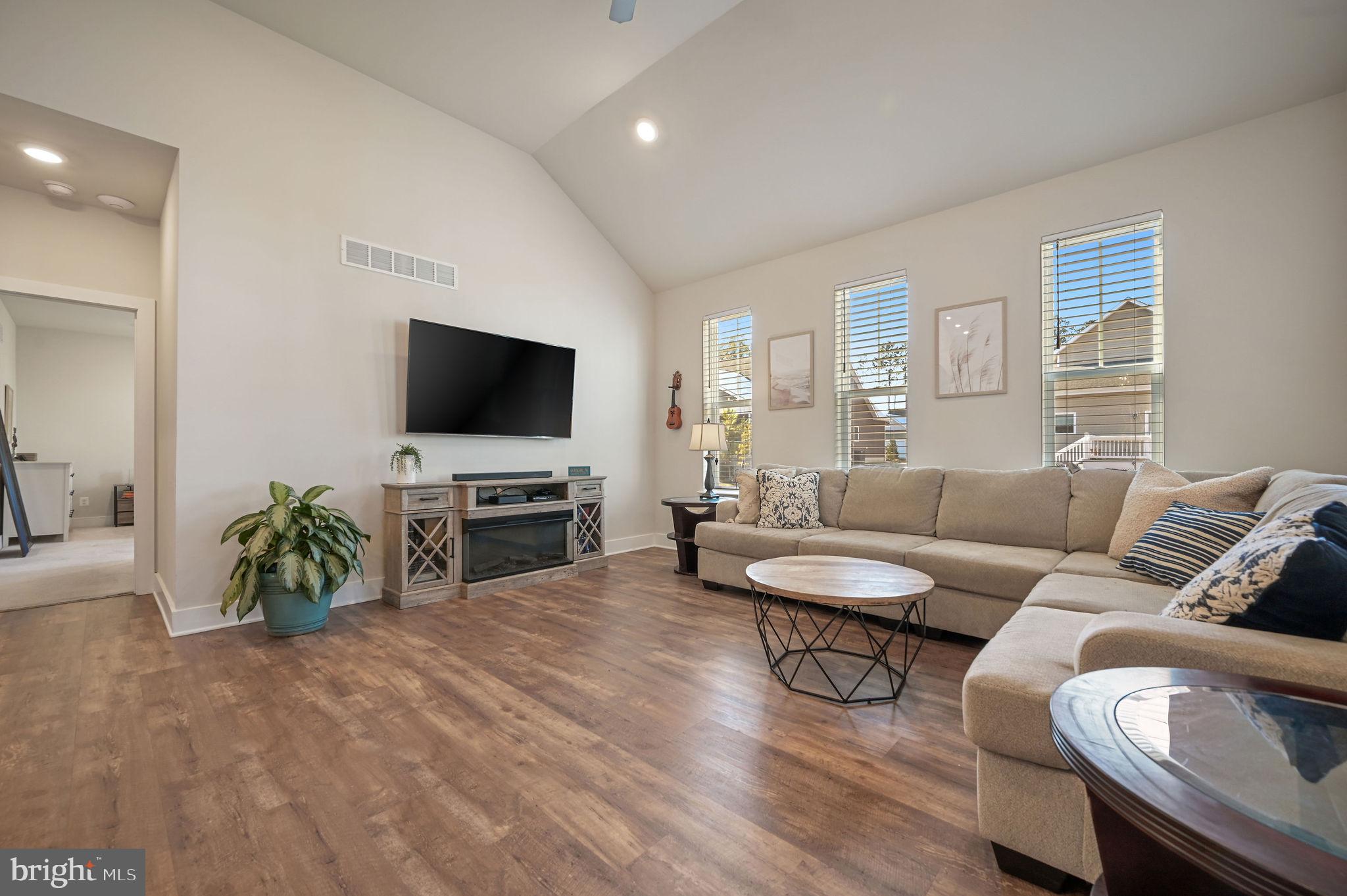 18556 Emerson Way Georgetown, DE 19947 - Photo 14 of 30 a living room with furniture and a flat screen tv