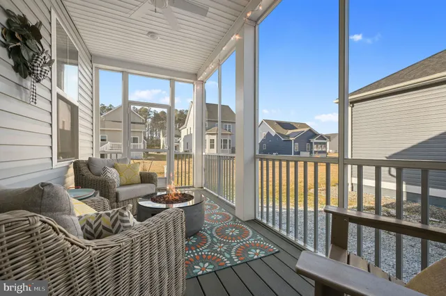 a view of balcony with couch and wooden floor