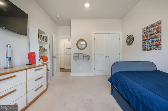 a bedroom with a bed and cabinets