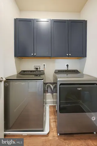 a utility room with cabinets
