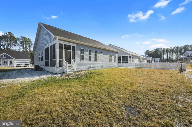 a front view of house with yard and seating area