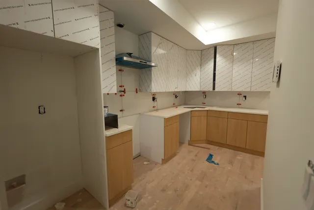 a view of a utility room with sink dryer and washer