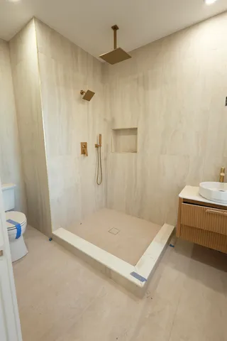 a bathroom with a tub and a shower