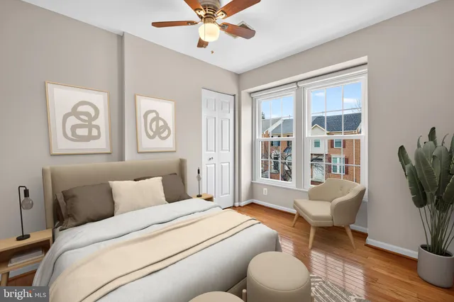 a living room with furniture and large windows