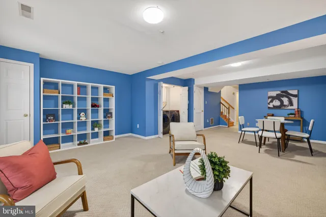 a view of a storage & utility room with dryer and washer