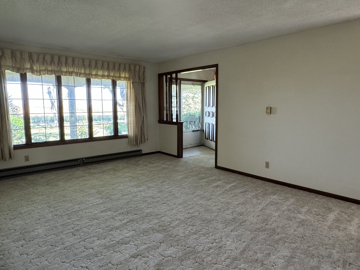 3222 250 East Road Herscher, IL 60941 - Photo 6 of 31 a view of an empty room with a fireplace and a window