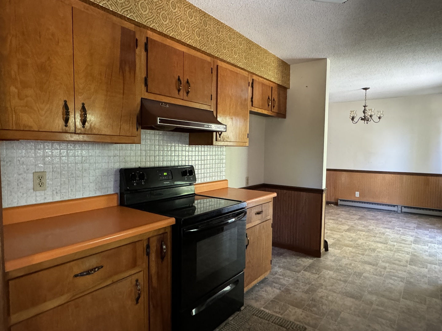 3222 250 East Road Herscher, IL 60941 - Photo 9 of 31 a kitchen with stainless steel appliances granite countertop a stove a sink and a microwave