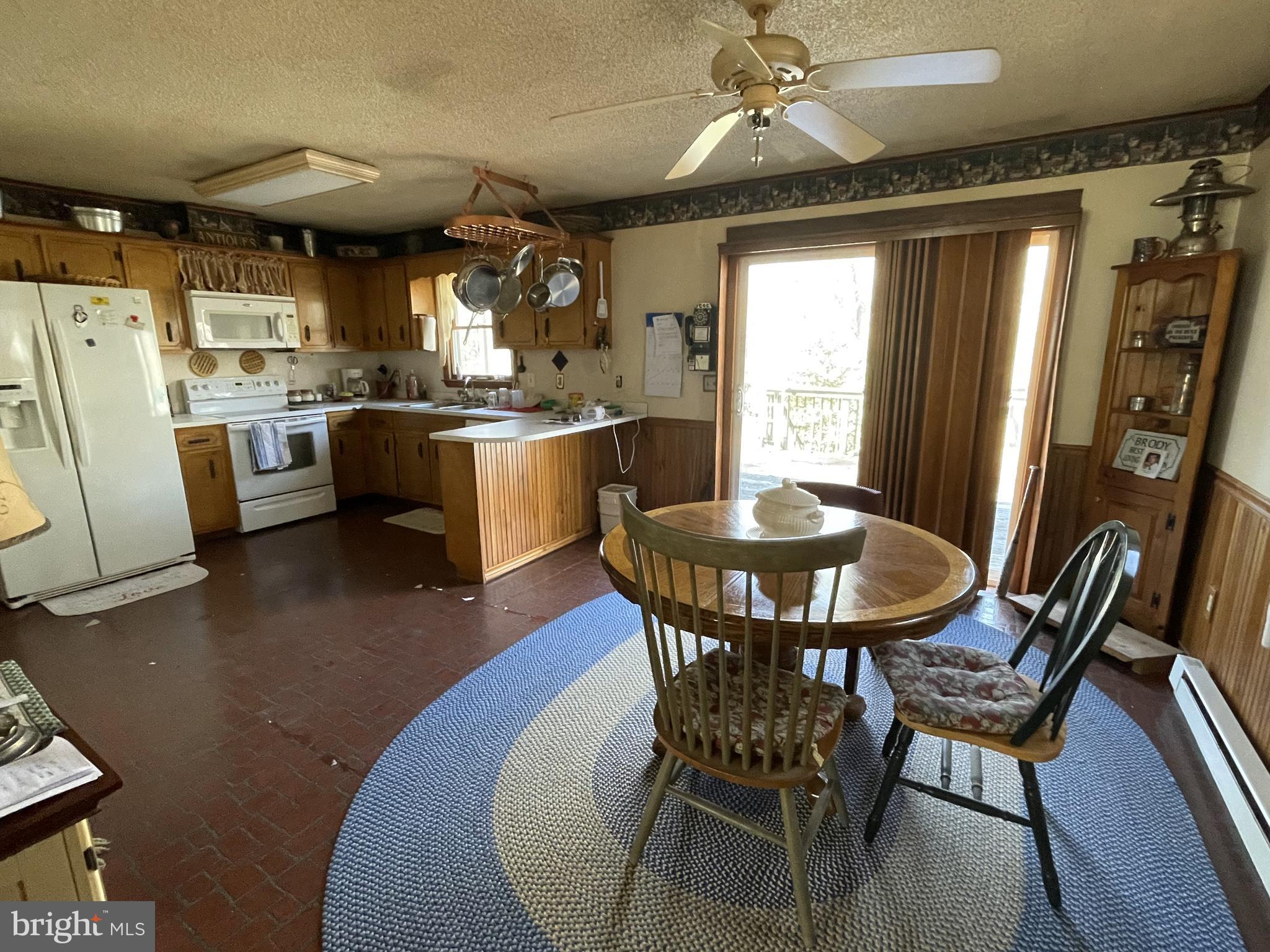 14706 Cherry Lane Ridgely, MD 21660 - Photo 2 of 17 a view of a dining room with furniture window and wooden floor
