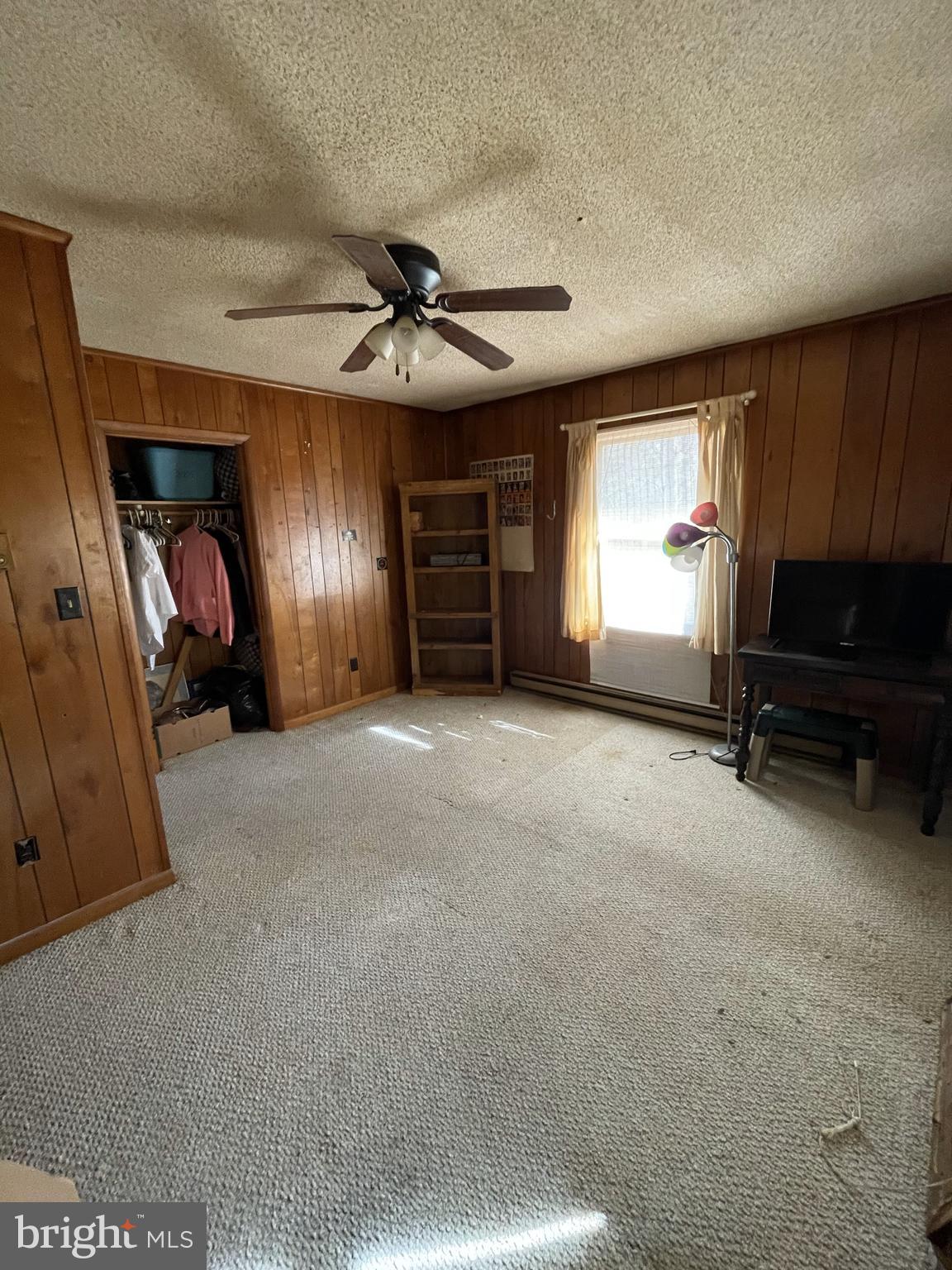 14706 Cherry Lane Ridgely, MD 21660 - Photo 5 of 17 a view of a livingroom with furniture and a ceiling fan