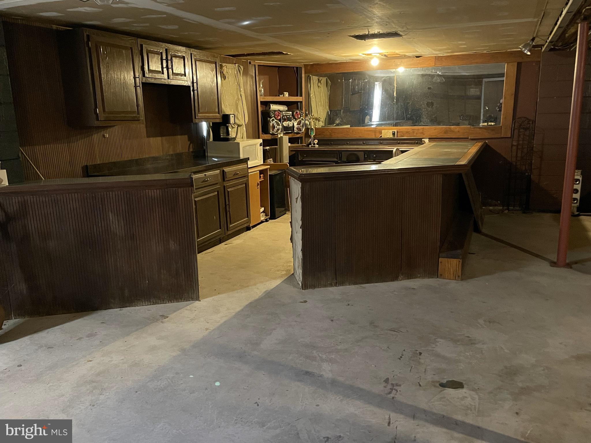 14706 Cherry Lane Ridgely, MD 21660 - Photo 8 of 17 a kitchen with stainless steel appliances granite countertop a sink a stove and a refrigerator