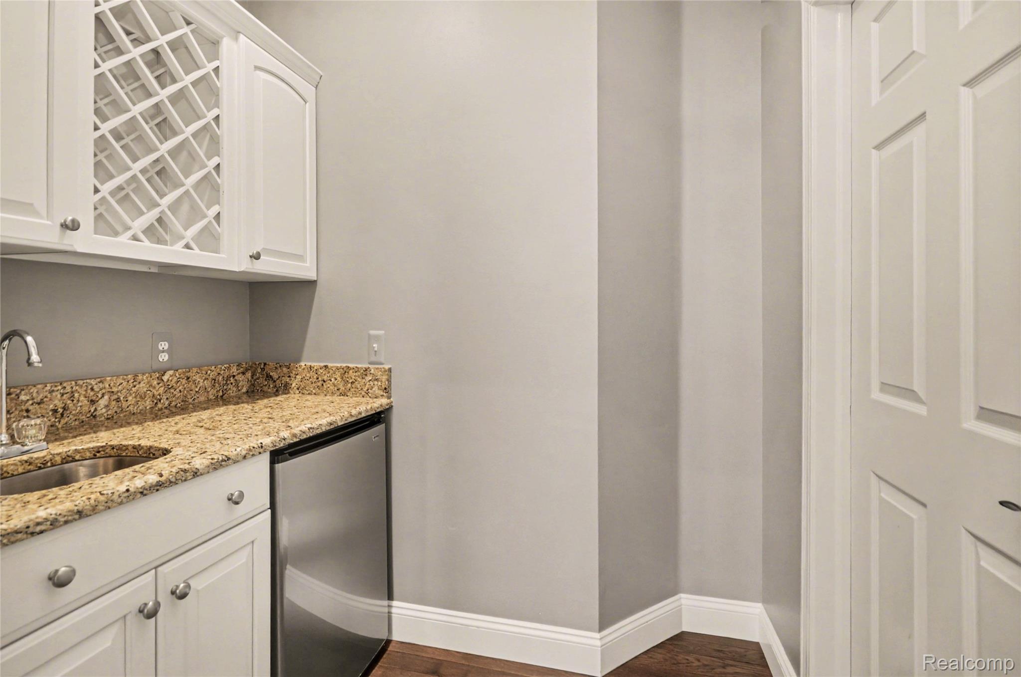 4179 St Andrews Street Howell, MI 48843 - Photo 17 of 75 Butler's pantry with wet bar opens up to the 1st floor office.