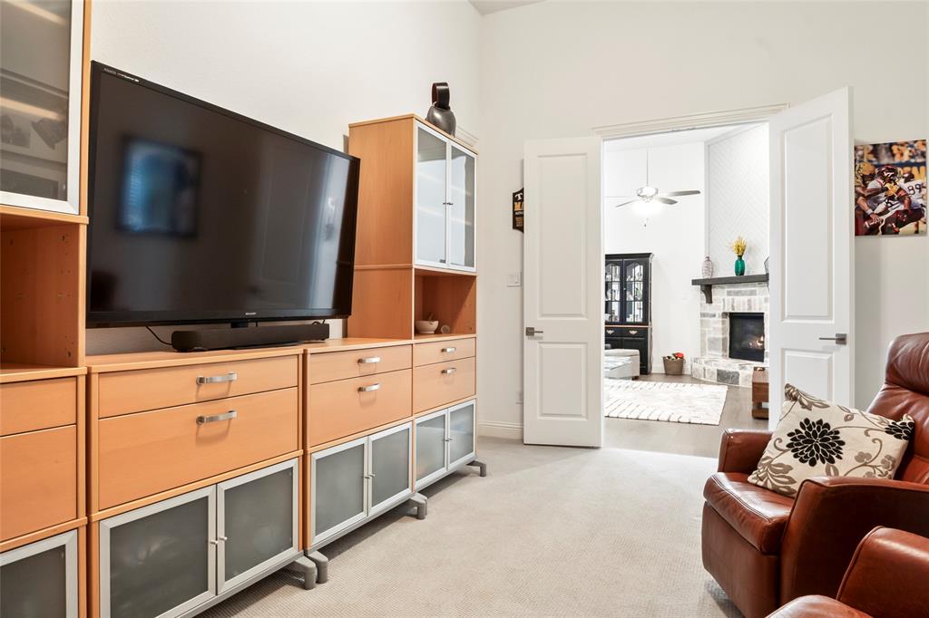 2109 Georgetown Boulevard Prosper, TX 75078 - Photo 16 of 40 a living room with furniture and a flat screen tv