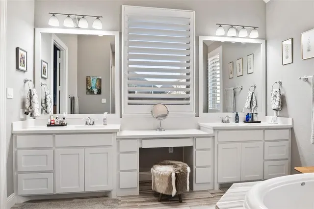 a room with a sink and a mirror