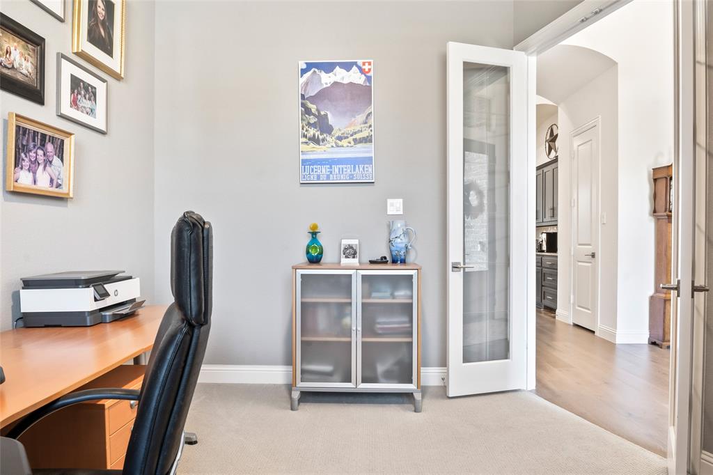 2109 Georgetown Boulevard Prosper, TX 75078 - Photo 23 of 40 a view of a workspace with furniture and a window