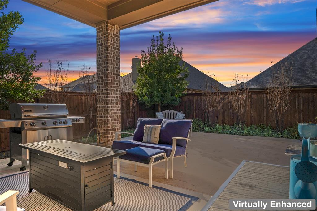 2109 Georgetown Boulevard Prosper, TX 75078 - Photo 32 of 40 a backyard of a house with table and chairs