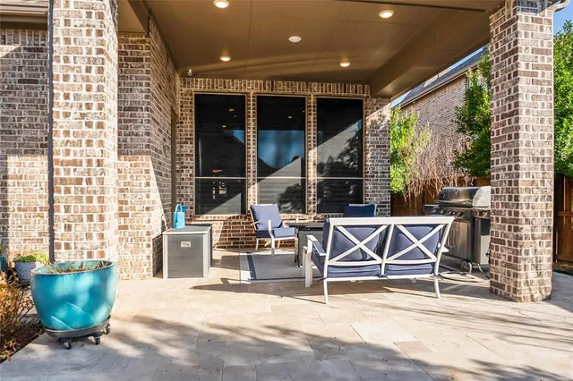 a view of a chairs and table in the patio