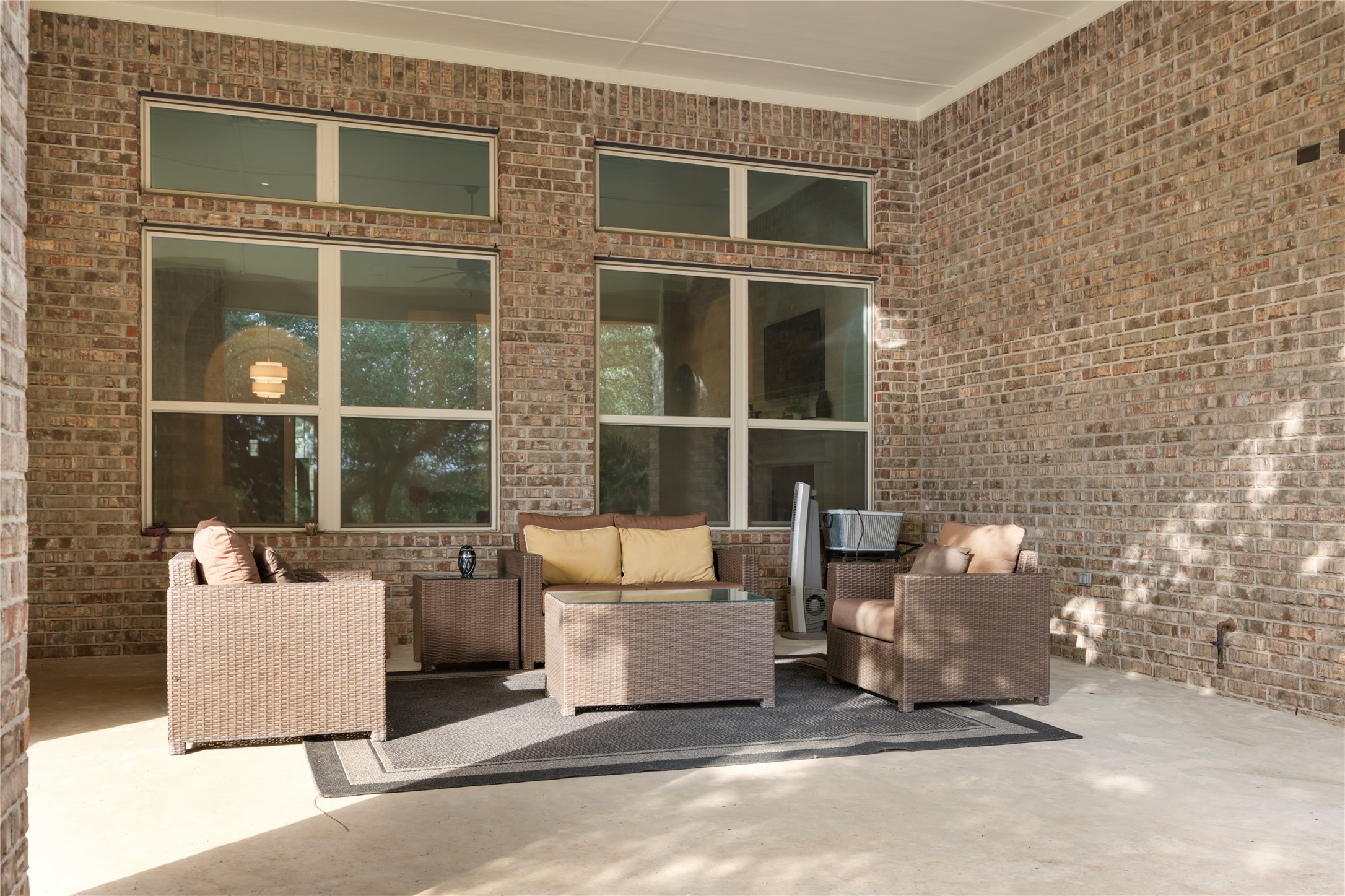 415 Bitterroot Lane Austin, TX 78737 - Photo 21 of 25 A welcoming outdoor patio with brick construction, ideal for relaxation and social gatherings.