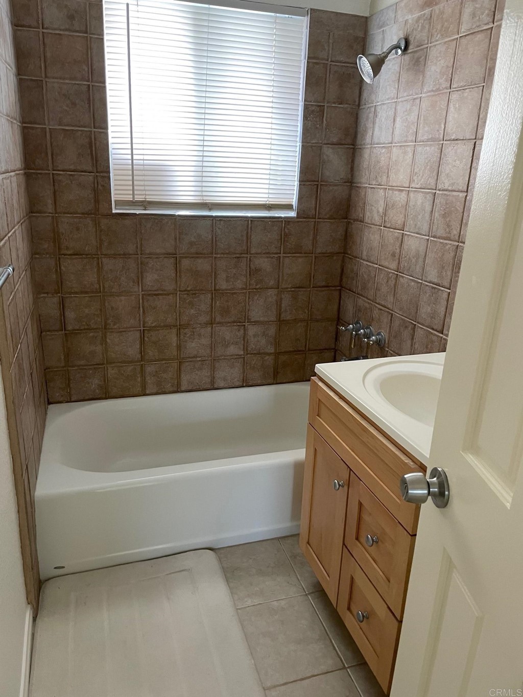 1465 Neptune Avenue Encinitas, CA 92024 - Photo 3 of 13 a bathroom with a bathtub and a window