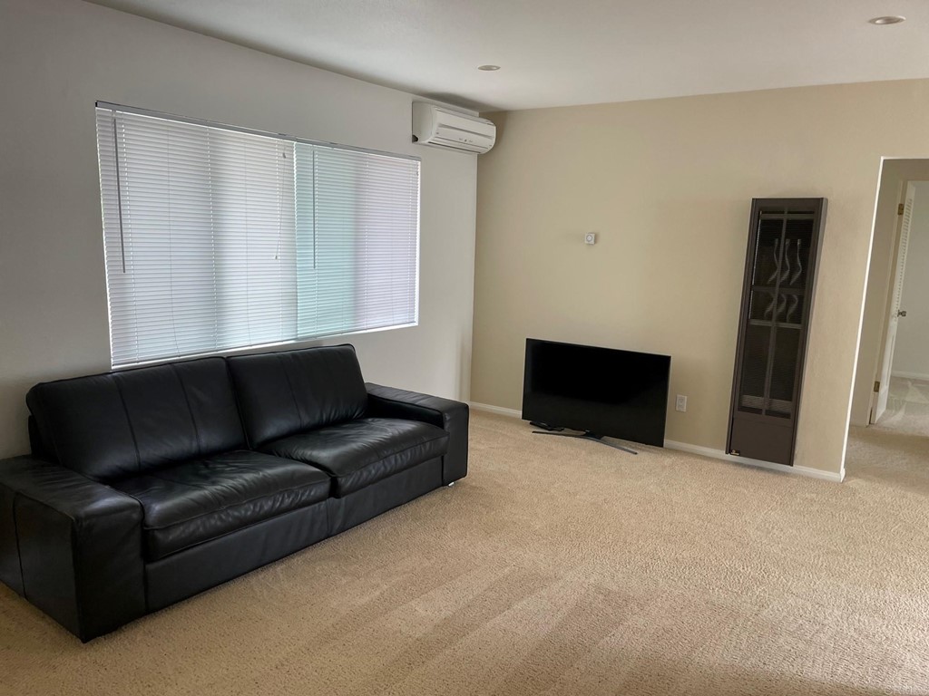 1465 Neptune Avenue Encinitas, CA 92024 - Photo 5 of 13 a living room with furniture and a fireplace