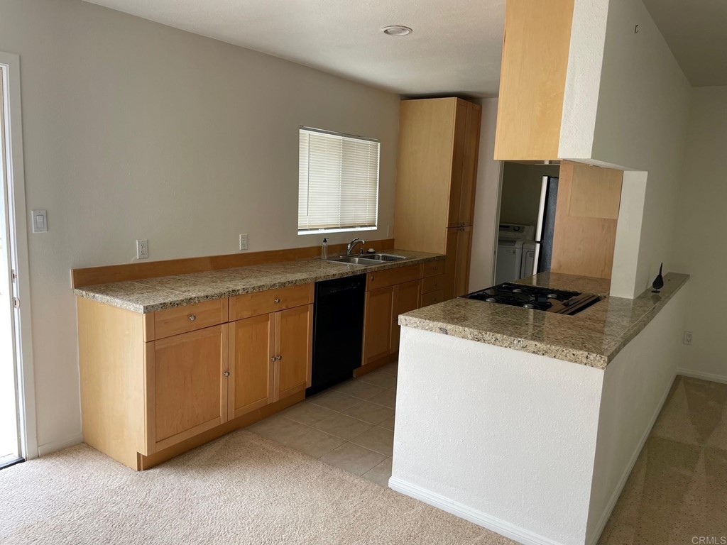 1465 Neptune Avenue Encinitas, CA 92024 - Photo 6 of 13 a view of a kitchen with a sink