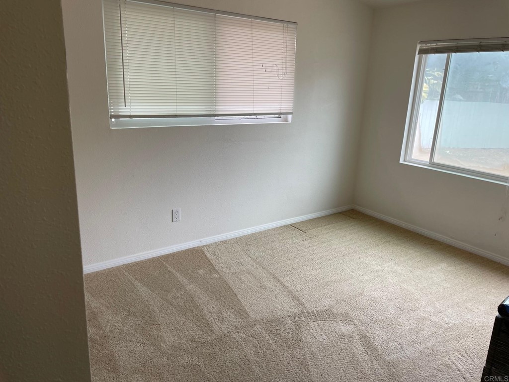 1465 Neptune Avenue Encinitas, CA 92024 - Photo 9 of 13 a view of an empty room with a window
