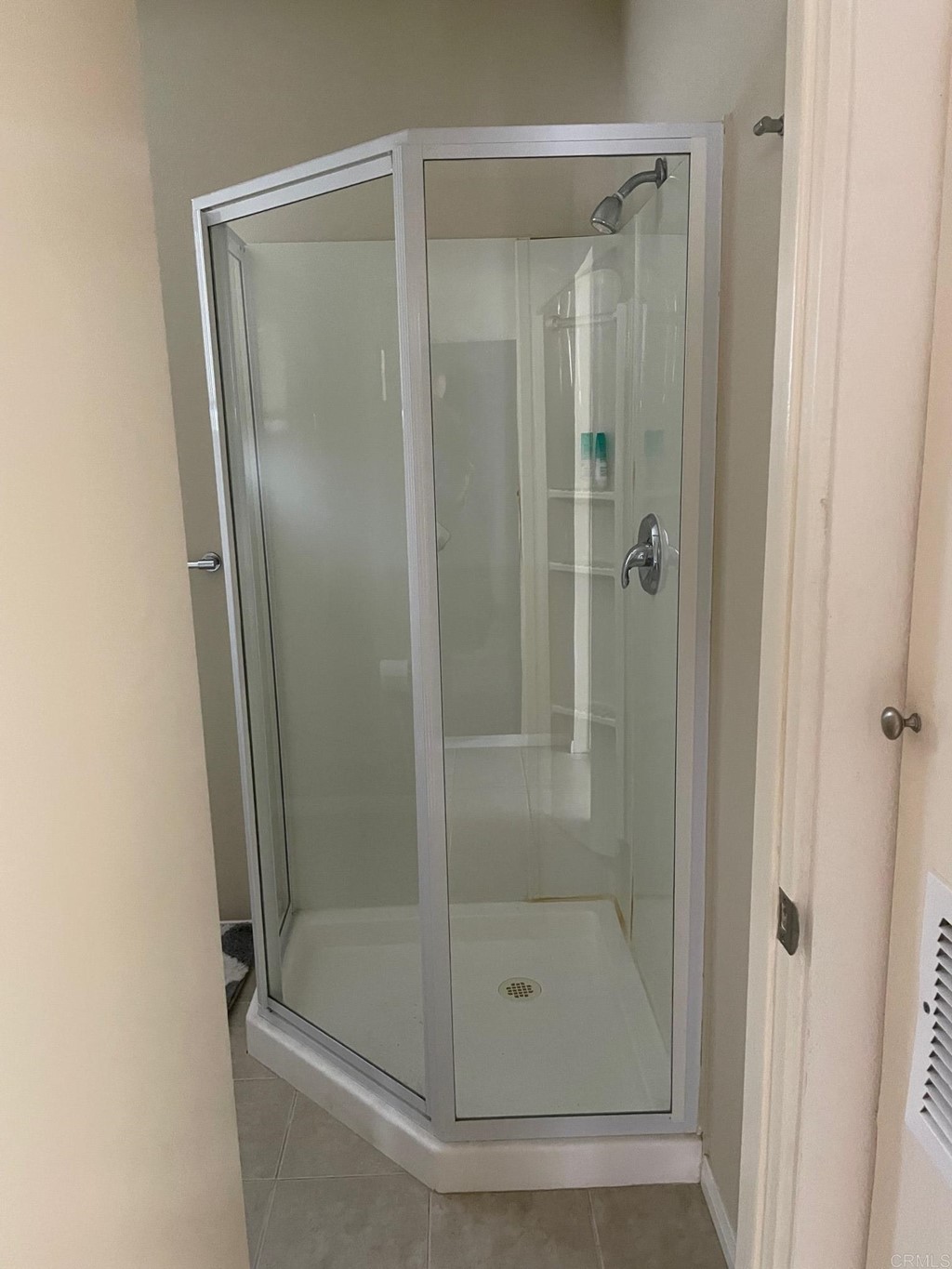 1465 Neptune Avenue Encinitas, CA 92024 - Photo 10 of 13 a bathroom with a glass shower door