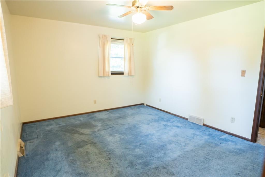 3565 Tuscarawas Road Beaver, PA 15009 - Photo 15 of 37 an empty room with a window and a ceiling fan