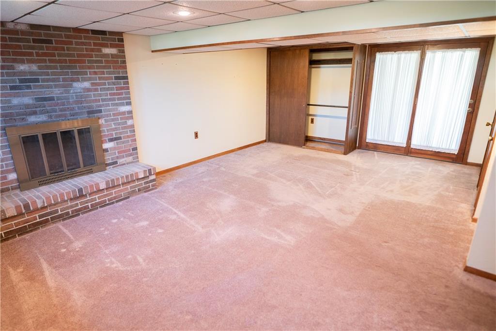 3565 Tuscarawas Road Beaver, PA 15009 - Photo 19 of 37 a view of an empty room with a fireplace and a window