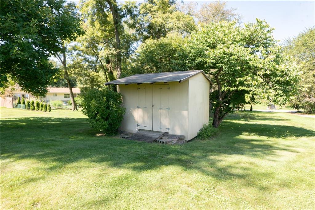 3565 Tuscarawas Road Beaver, PA 15009 - Photo 28 of 37 a backyard of a house with plants and large trees