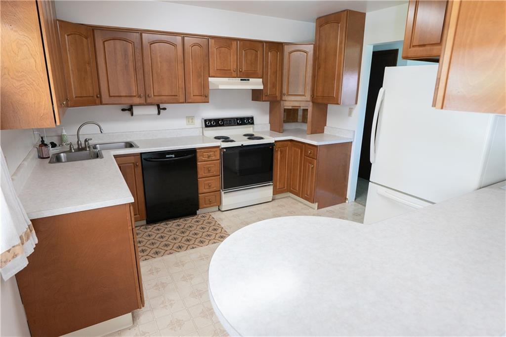 3565 Tuscarawas Road Beaver, PA 15009 - Photo 3 of 37 a kitchen with stainless steel appliances a sink a stove a refrigerator cabinets and a counter top space