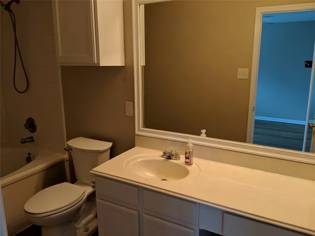 a bathroom with a sink and a toilet