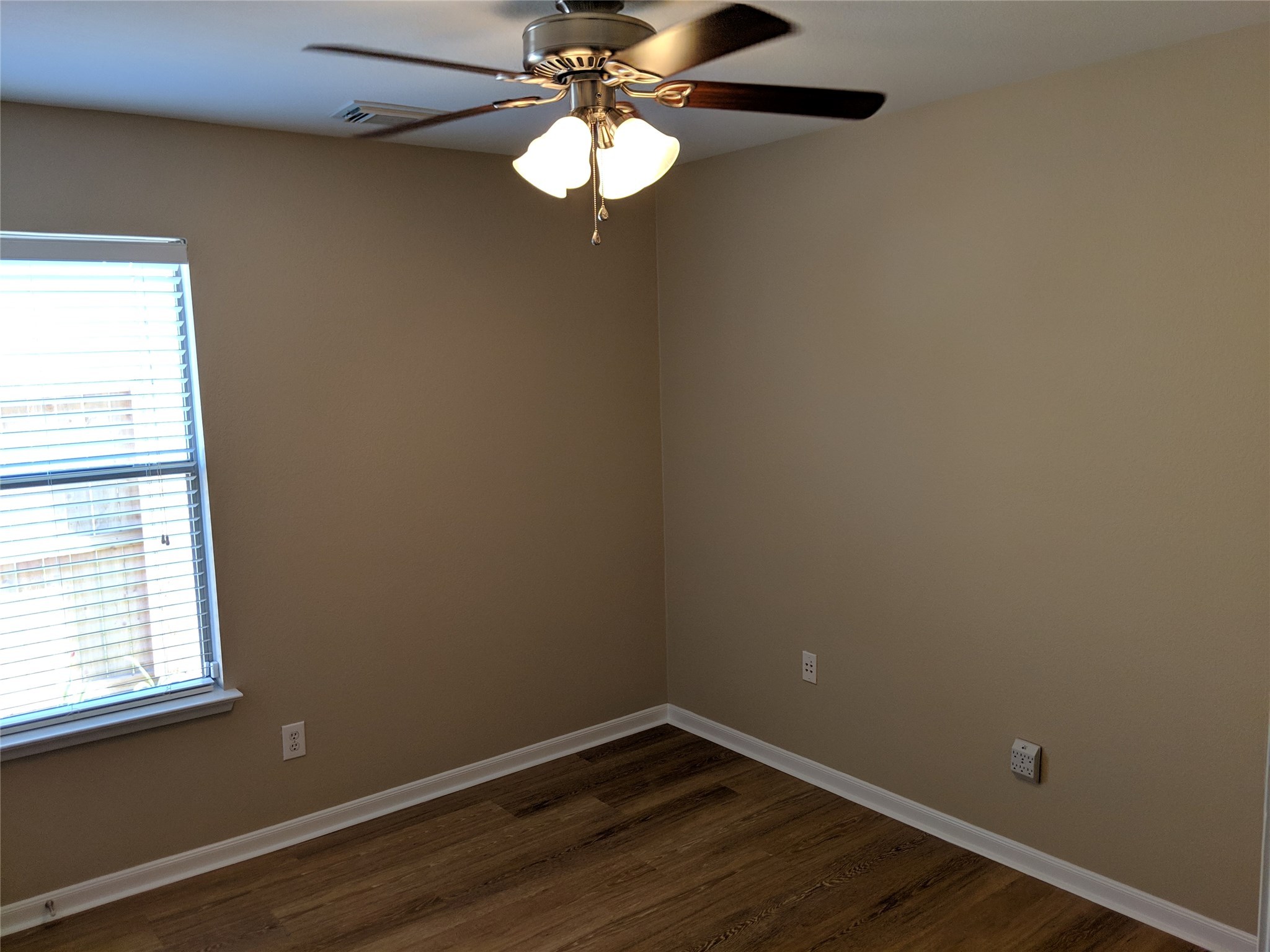 21210 Shadow River Lane Spring, TX 77379 - Photo 15 of 21 a view of a small space with wooden floor and a window