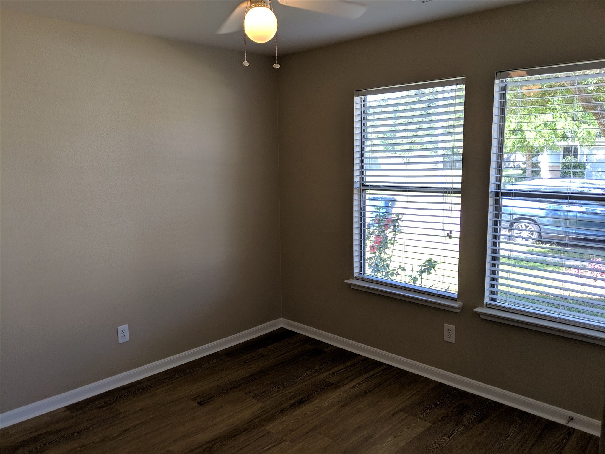 21210 Shadow River Lane Spring, TX 77379 - Photo 17 of 21 a view of an empty room with wooden floor and a window
