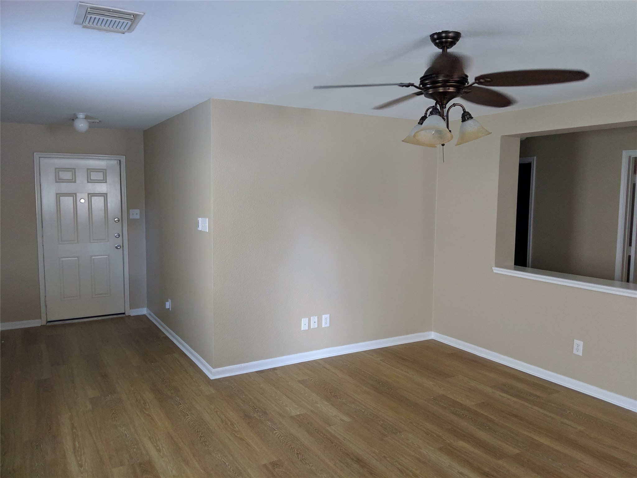 21210 Shadow River Lane Spring, TX 77379 - Photo 3 of 21 a view of a room with wooden floor and ceiling fan