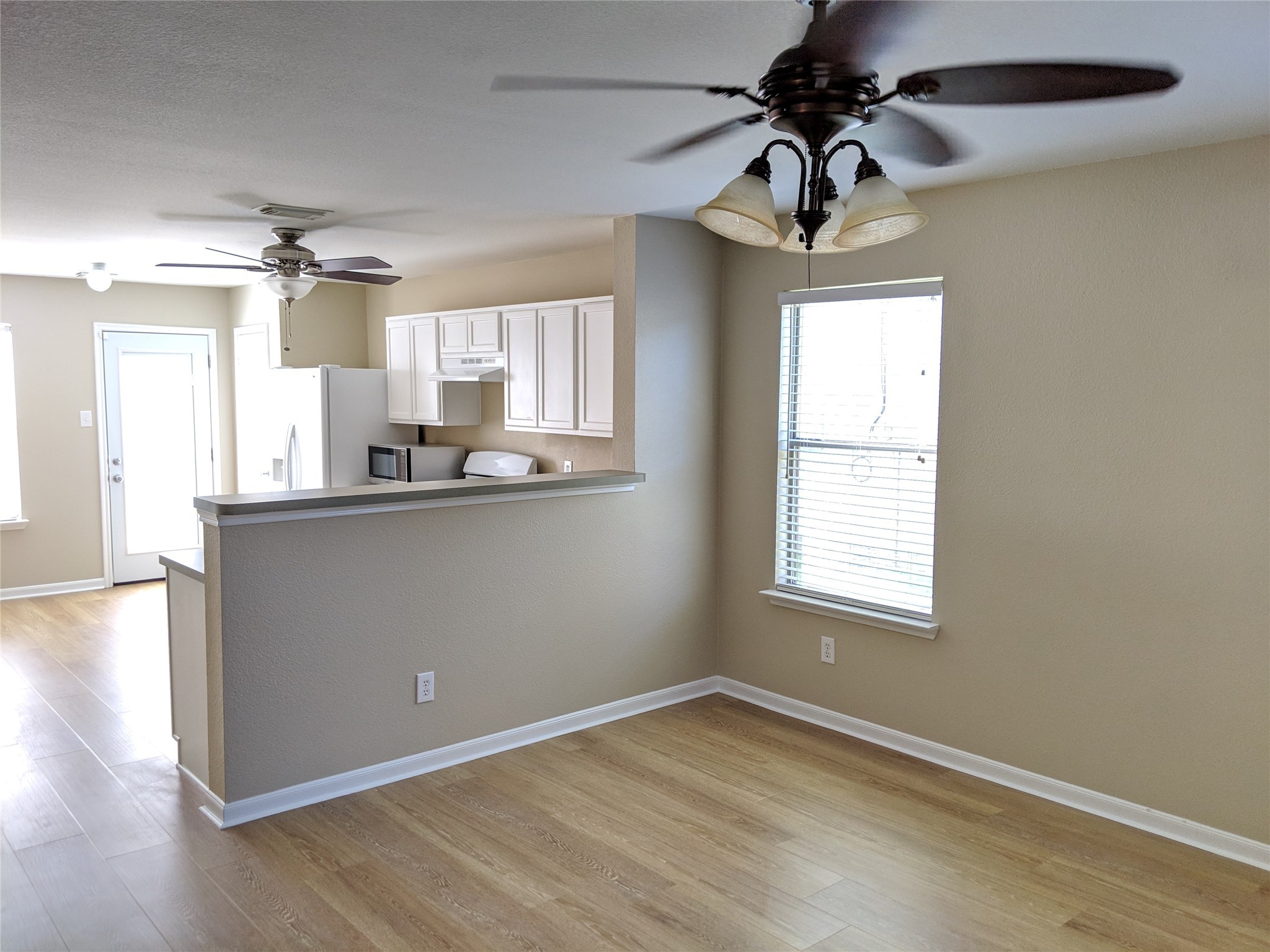 21210 Shadow River Lane Spring, TX 77379 - Photo 9 of 21 a kitchen with stainless steel appliances granite countertop a sink cabinets and a window