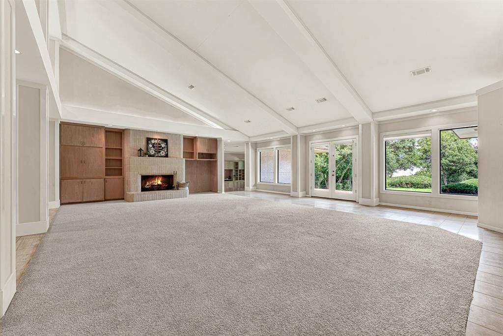 933 Mobley Road Cedar Hill, TX 75104 - Photo 12 of 40 Large gas fireplace with hearth to bring warmth and cheer to a cool night. Built in bookcases for media needs.