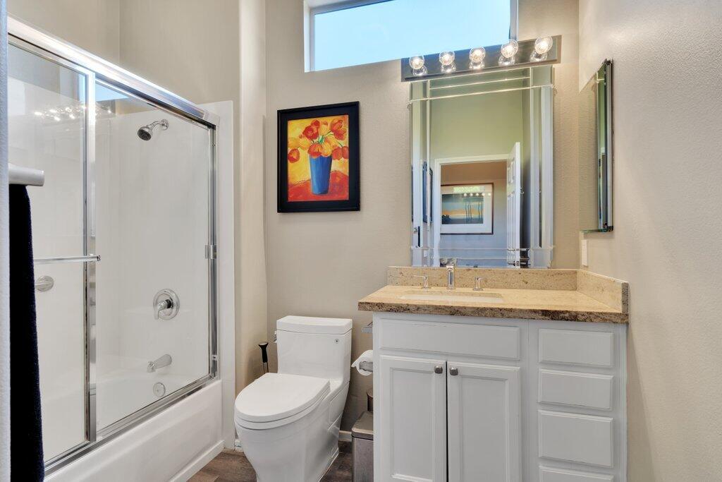 39357 Mirage Circle Palm Desert, CA 92211 - Photo 19 of 32 a bathroom with a granite countertop toilet sink and shower