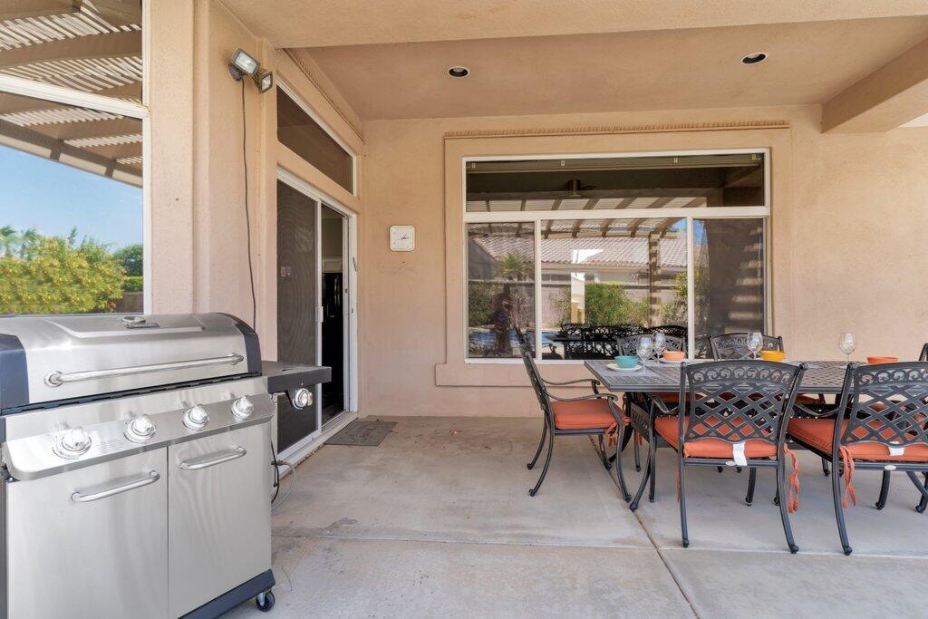 39357 Mirage Circle Palm Desert, CA 92211 - Photo 22 of 32 a dining room with furniture and a window