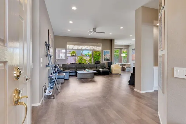 a living room with furniture and a large window