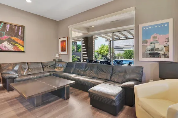 a living room with furniture and a large window