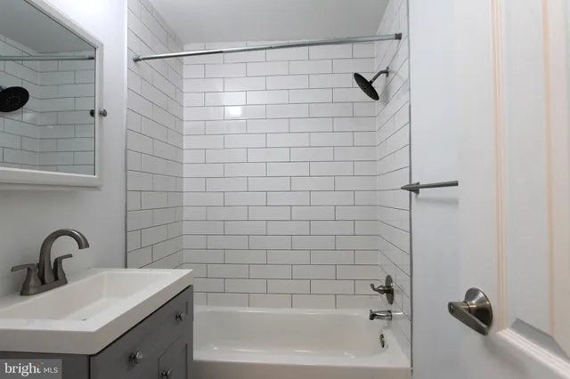 a bathroom with a sink and shower