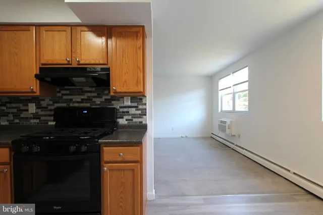 a kitchen with a sink and a stove top oven