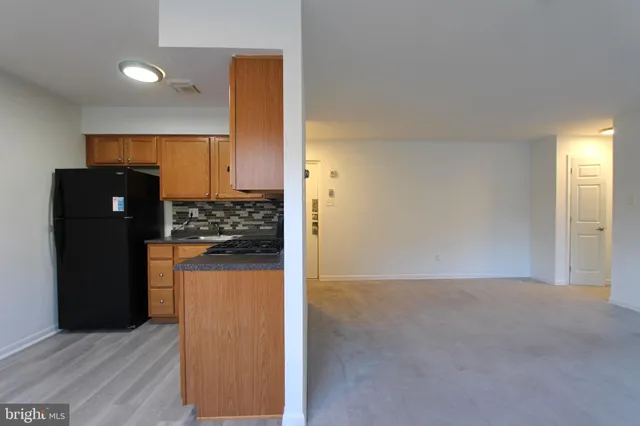 a view of a kitchen with a refrigerator