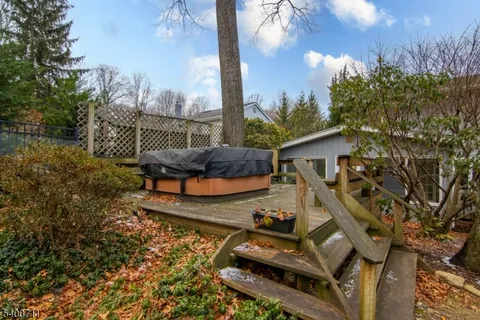 a view of a swimming pool and lounge chairs