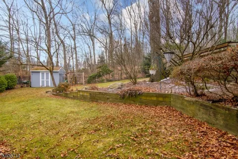 a view of swimming pool with outdoor seating and yard