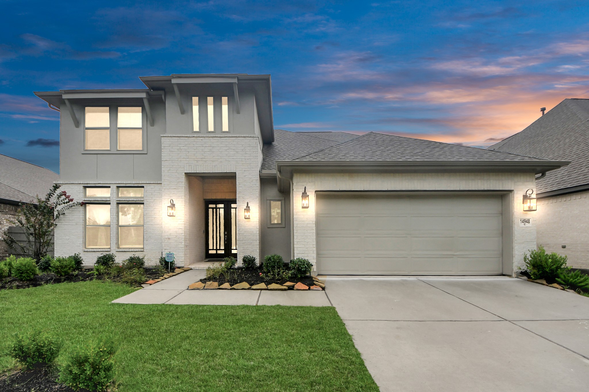 14948 Galileo Gates Drive Conroe, TX 77302 - Photo 1 of 30 a front view of a house with a yard and garage