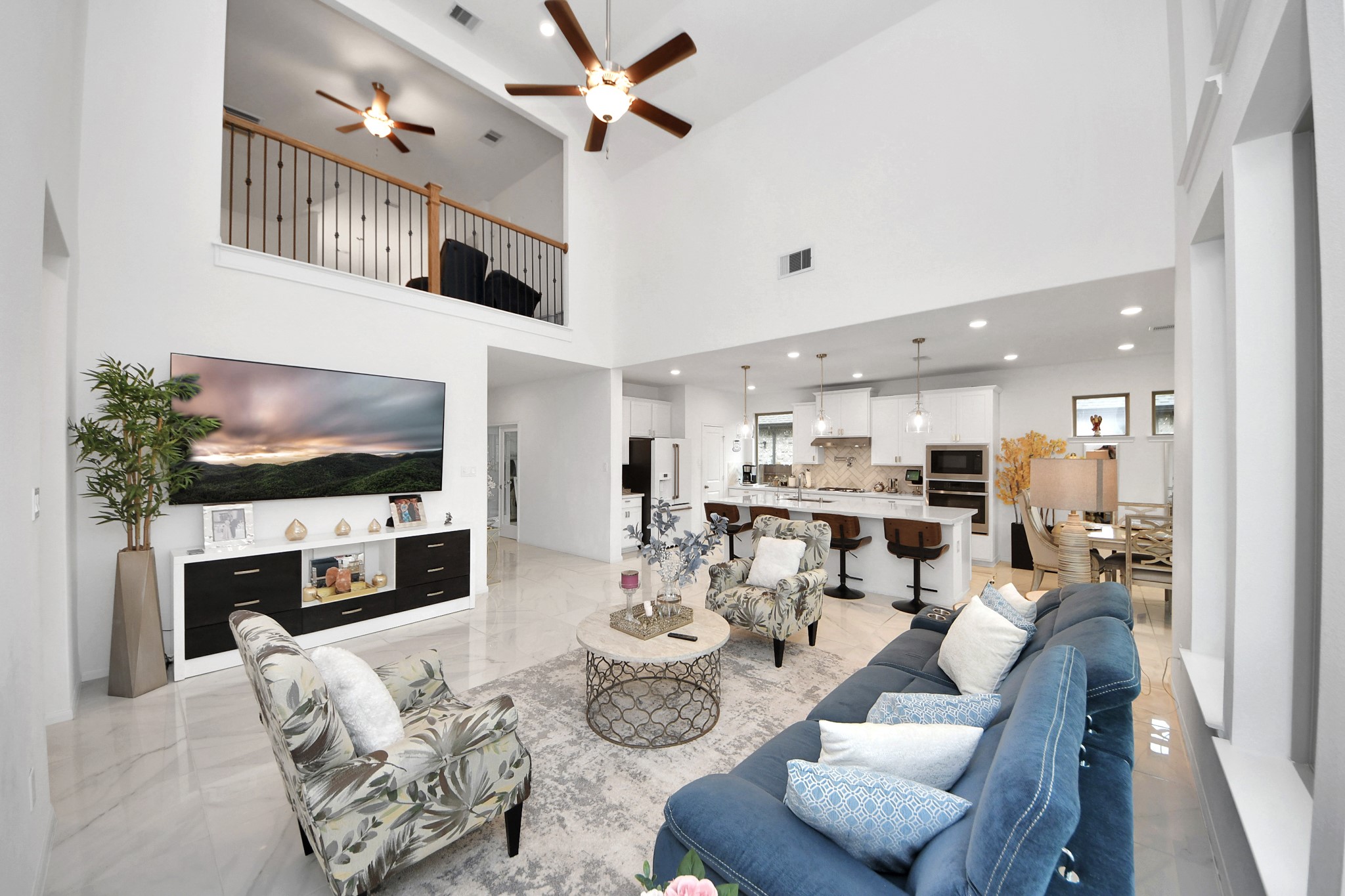 14948 Galileo Gates Drive Conroe, TX 77302 - Photo 12 of 30 a living room with furniture a flat screen tv and a fireplace