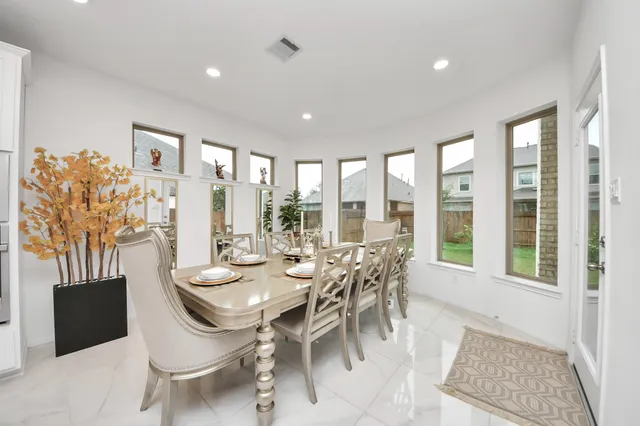 a view of a dining room with furniture window and outside view
