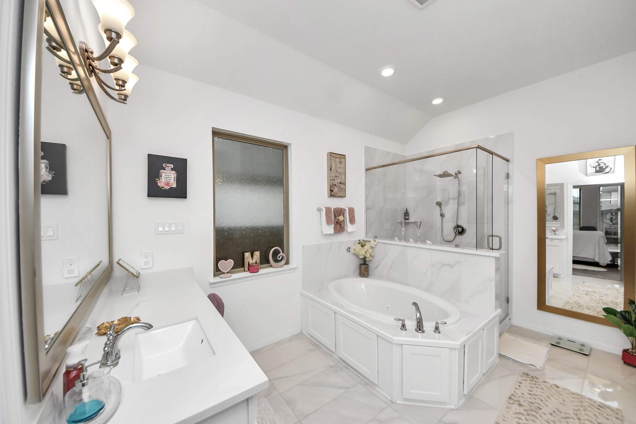 14948 Galileo Gates Drive Conroe, TX 77302 - Photo 18 of 30 a bathroom with a tub a sink and a shower