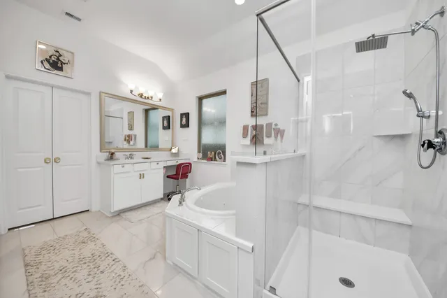 a bathroom with a sink a tub and a shower